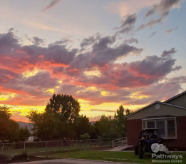 A house with an ATV in the background during a sunset in Utah.