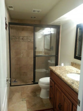 An alcohol rehab center providing mental health care in Utah with a bathroom featuring a glass shower stall.