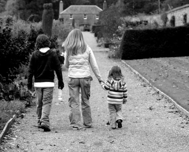 children walking towards home
