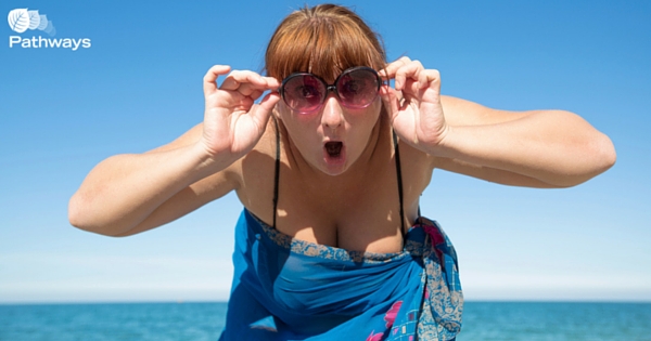 Confident woman on the beach - 7 Tips to Have a Body Positive Summer