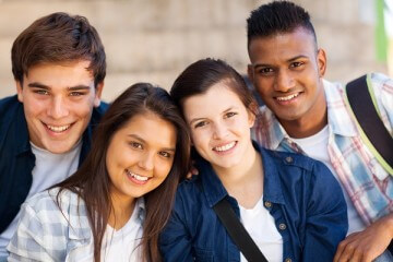 group of happy teen high school students outdoors group of happy teen high school students outdoors
